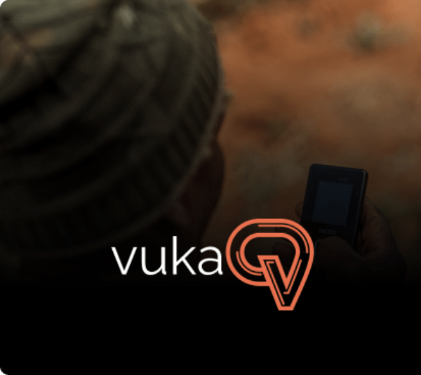 vuka logo with man using phone in the background