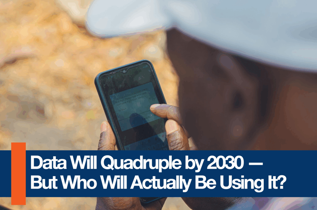 A close-up of a person’s hand using a mobile phone, with text visible on the screen, emphasizing the uneven realities behind Africa’s growing mobile data usage.